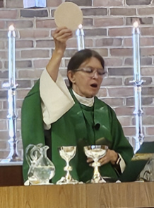 The Rev. Jean Vargo celebrating Holy Communion with St. Mark's parishioners.